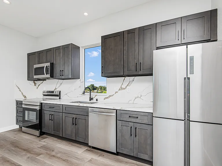 Stainless steel appliances - french refrigerator, quartz countertop