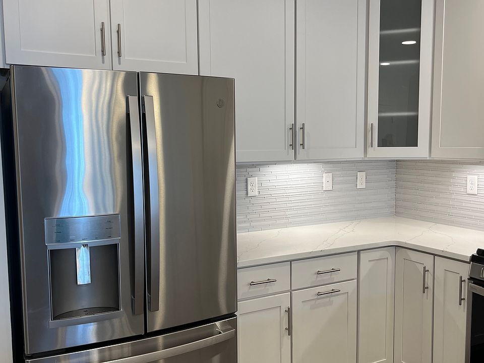 kitchen refrigerator with ice maker and freezer drawer