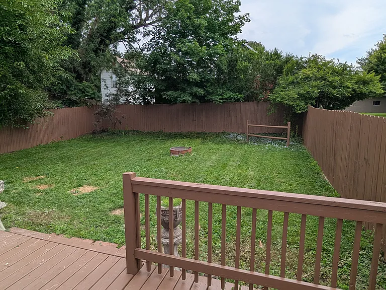 Large back deck overlooking fully fenced back yard
