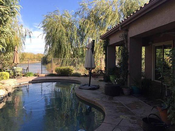 Gorgeous pool with soothing fountain and view of peaceful canal
