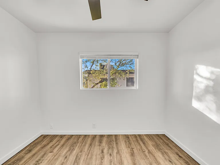 Comfortable large bedroom retreat filled with natural light.