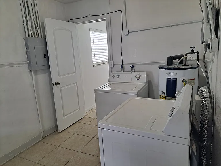 Utility Storage & Laundry Room with Washer and Dryer - View 2.