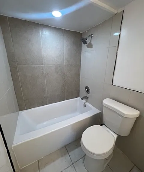 NEWLY REMODELED WITH NEW TOILET AND ITALIAN LUX TILE IN BATH 2