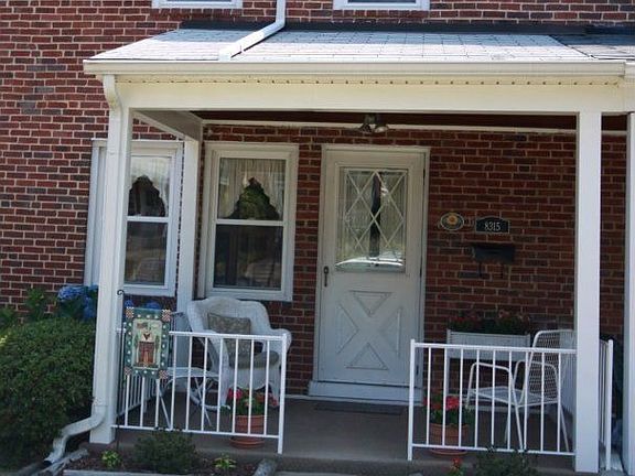 Great front porch with beautiful garden