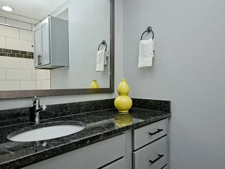 Fashionaire Bathroom sink, mirror, and counter