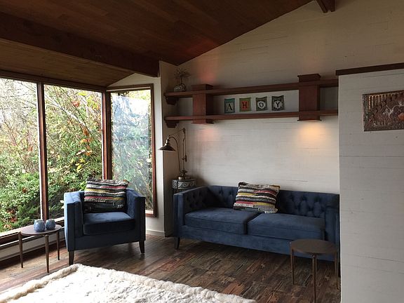 Living room with new floors and cedar ceiling