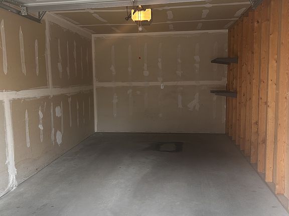 Inside 1 car garage with garage door opener