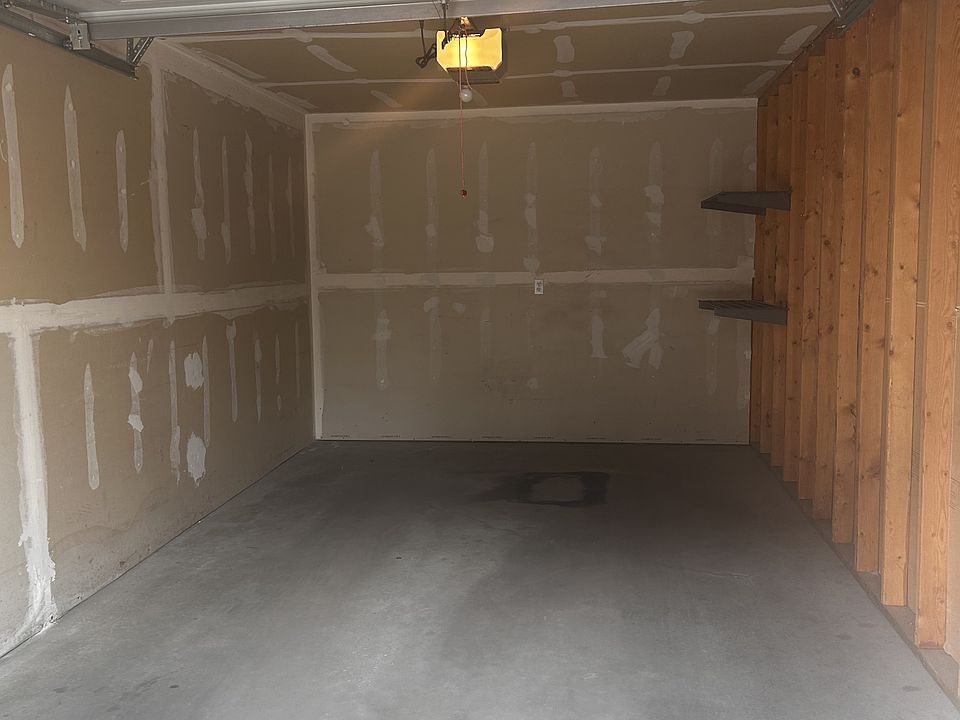 Inside 1 car garage with garage door opener