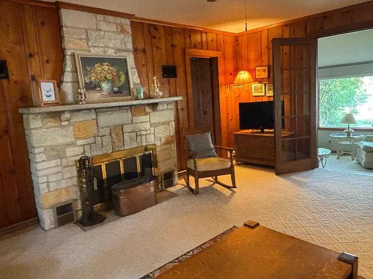 Living Room with French doors to seasonal porch.