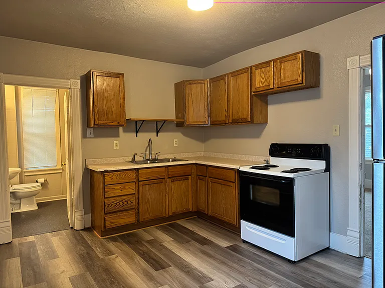 Kitchen with oven/stove and refrigerator included