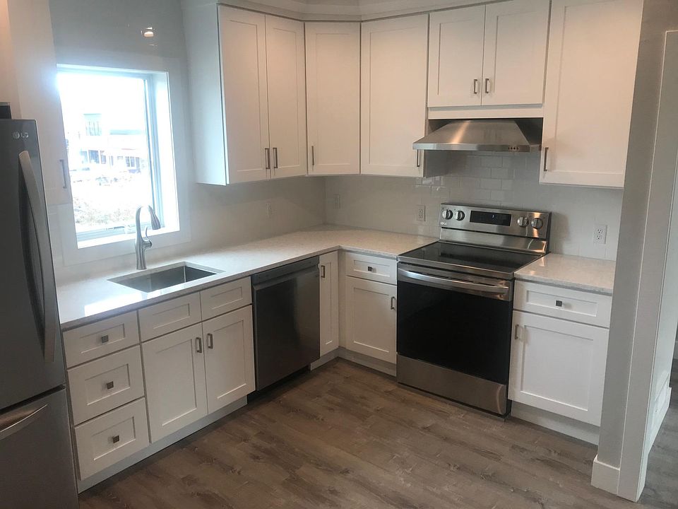 Kitchen with quartz counter tops. New stainless steel appliances.