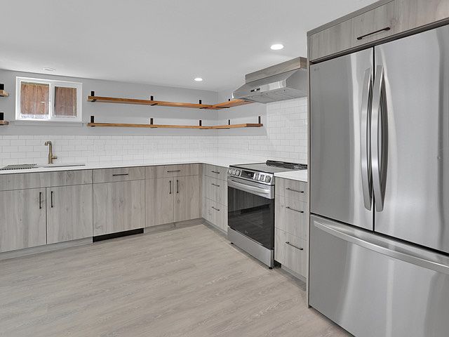 A proper cooks kitchen with New LG and Bosch appliances & Cosmo 600 cfm range hood. Built-in dishwasher is panel front to the right of the sink.