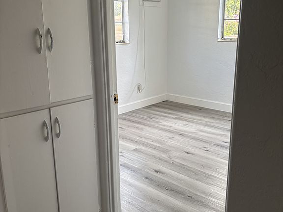 2nd bedroom - light and bright. Outside of it is a built in closet for linens