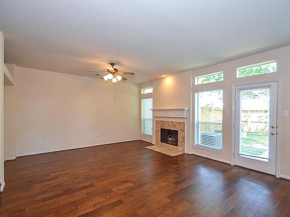 Light and bright den area w/cozy fireplace