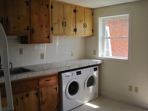 Kitchen window faces south onto patio.