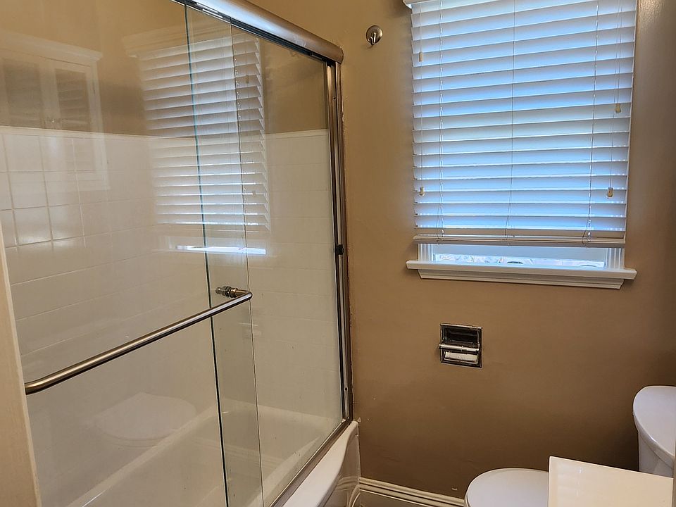 Another view of Bathroom with sliding glass shower door and has a bathtub