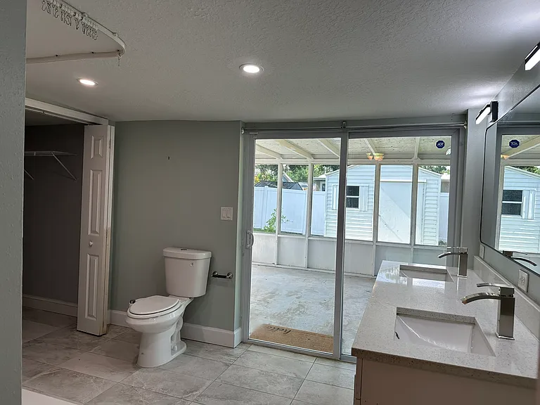 master bathroom view towards the screened in porch