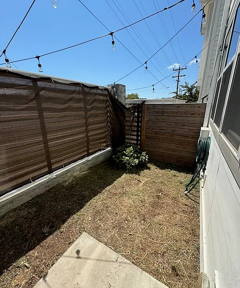 Fenced in Backyard w/ solar powered lights
