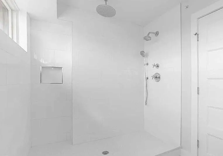 Fully equipped large size glass door shower.