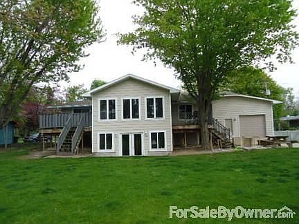 The Back yard : 2 Decks, 1 for privacy of Master Bedroom. Rear entrance into Office