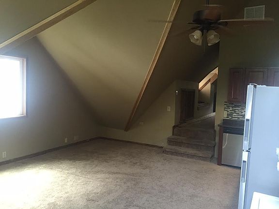 Through entrance looking into kitchen and living area 
