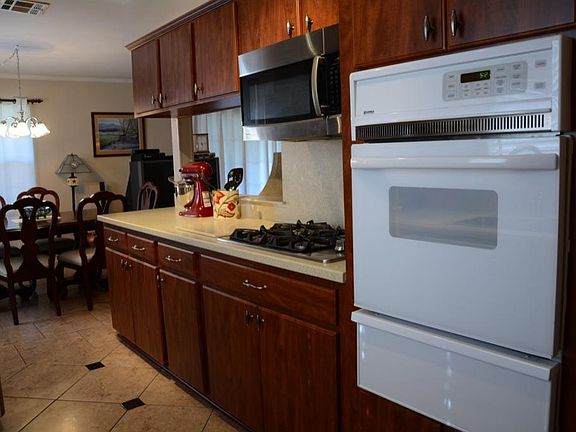 Another view shows the updated stove and microwave.