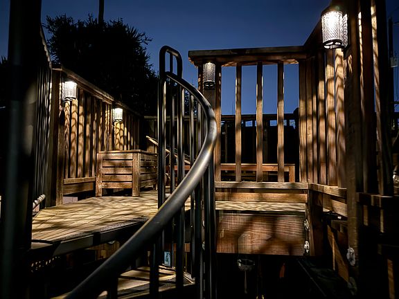 Night view of deck and recently added solar lighting.