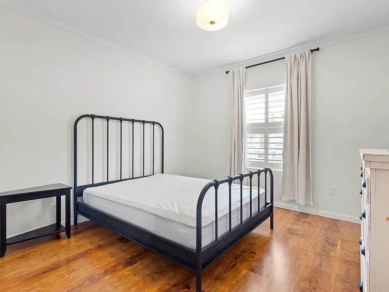 Queen size bed, large dresser for additional storage and black out curtains.
