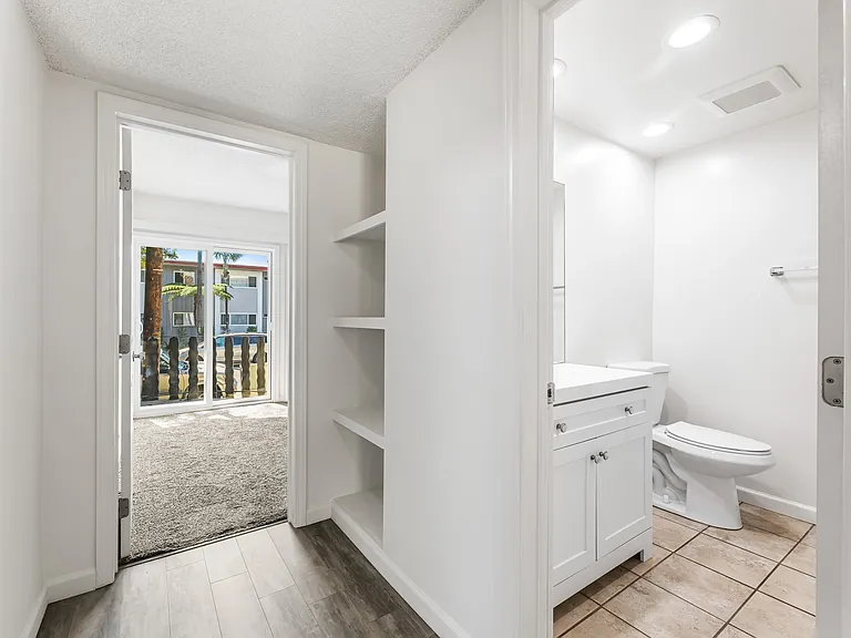 Bath, hallway and bedroom view