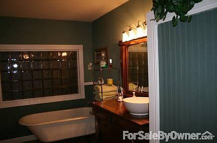 Master Bath
						:
						Claw foot tub for soaking baths and corner shower on left . Built in wardrobe.