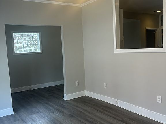 Living room and see through window to kitchen