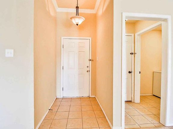 Interior entrance. Laundry room and garage entrance to the right.