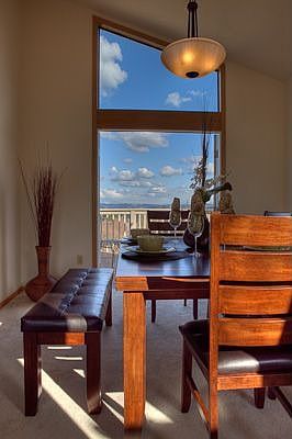 Dining room with french doors to deck and sweeping views of the cascades