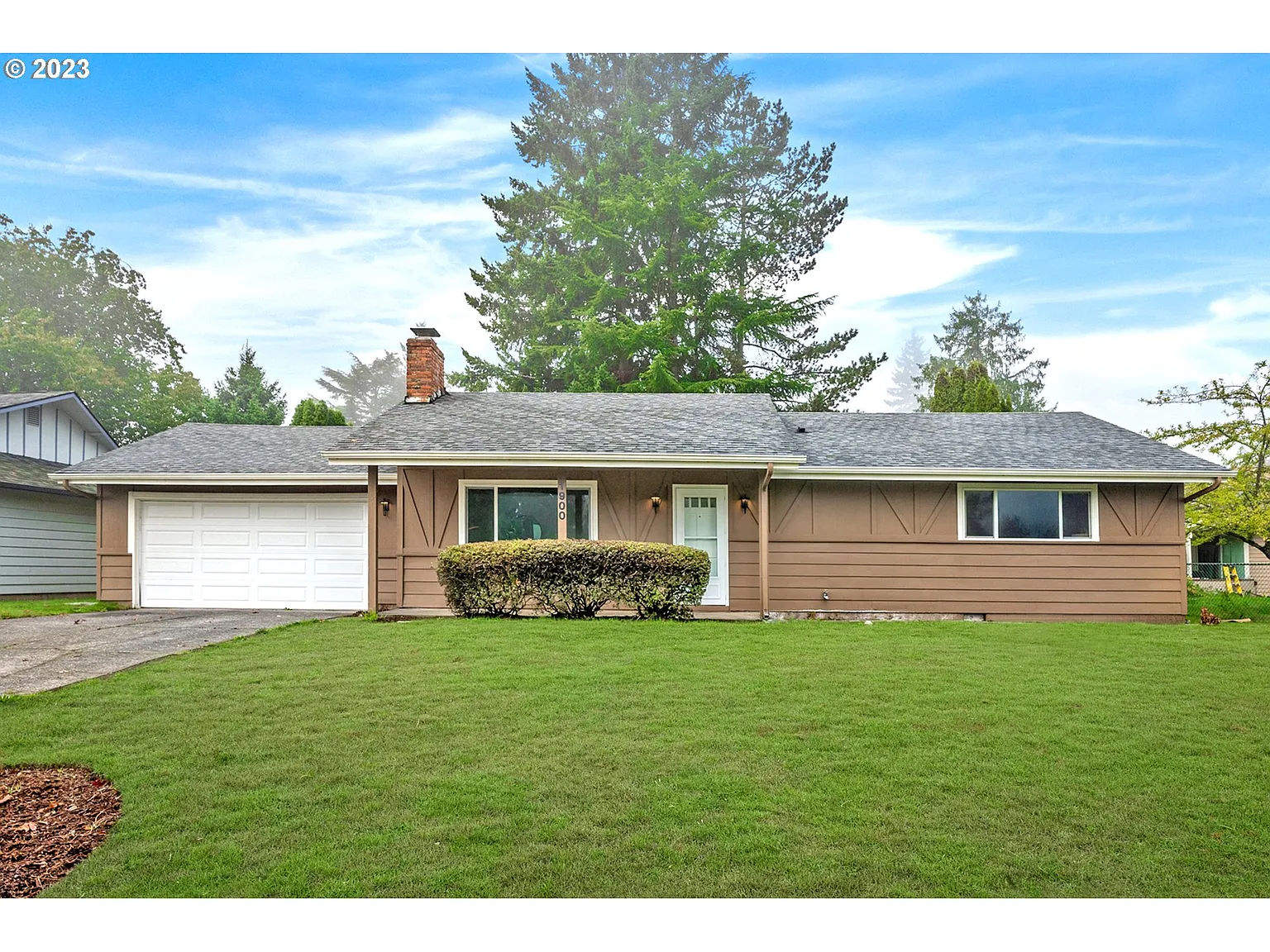1900 NE Village Green Dr photo 1