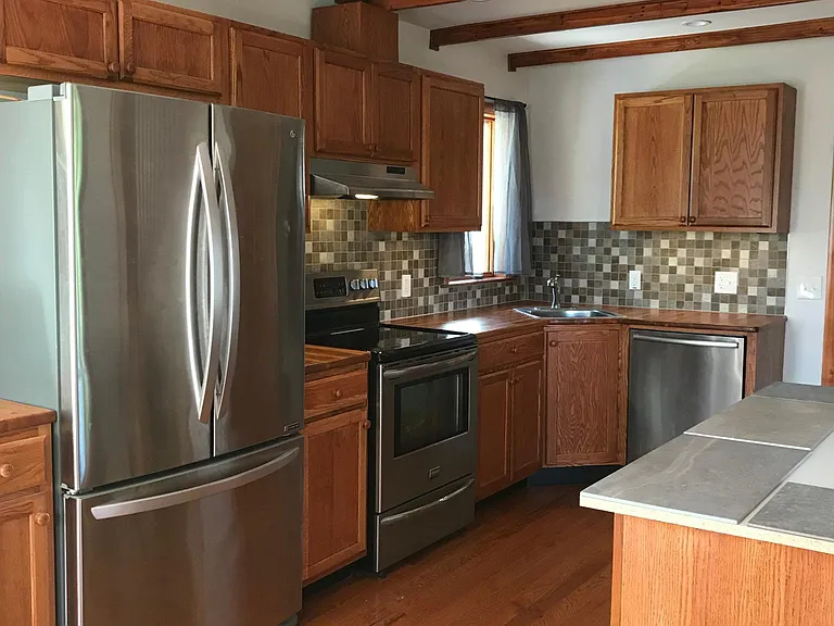 Kitchen with large island (partially shown on right).
