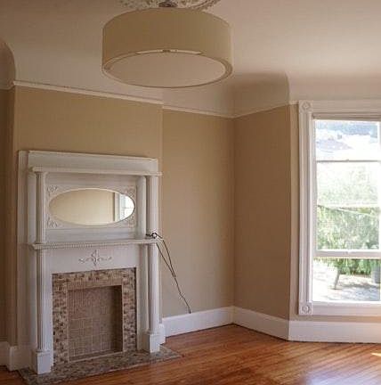 Recently restored hardwood floor in living room