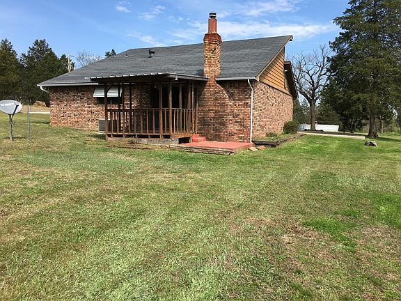 Rear w/ deck and patio.