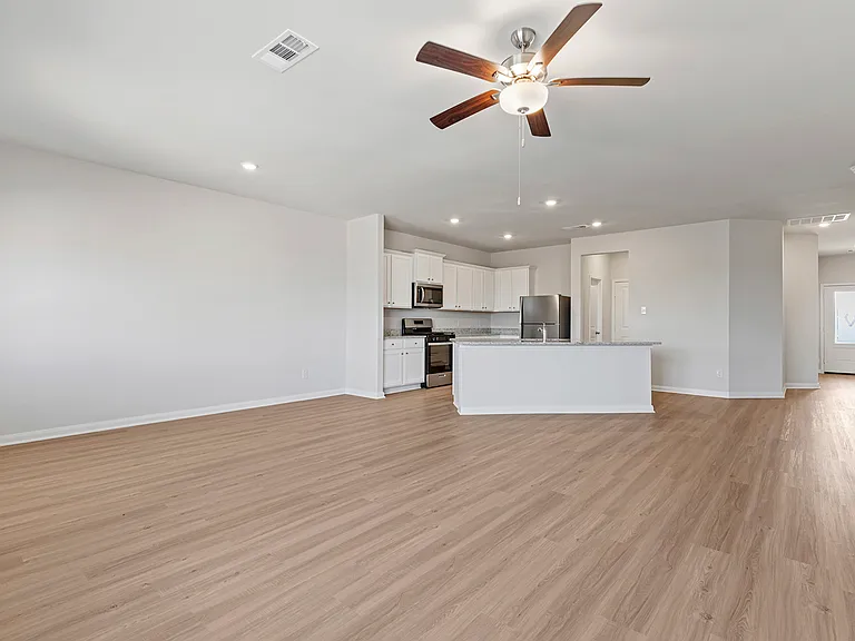 The kitchen overlooks the family room and dining room.