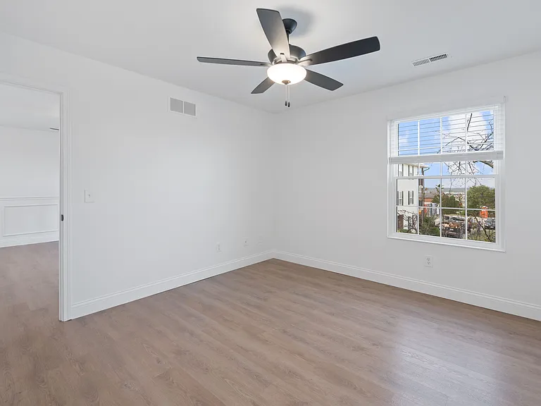 Experience the comfort of this spacious bedroom featuring natural light and modern design. Experience the comfort of this spacious bedroom featuring natural light and modern design.