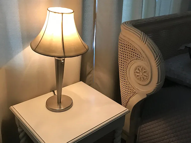 Bedroom 1-view of end table and lamp next to head of the bed