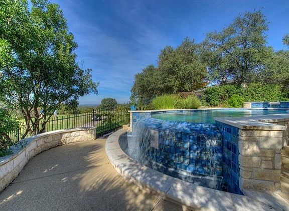 Negative edge waterfall to enjoy and watch the golfers go by.