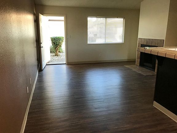 Living room with wood-burning fireplace