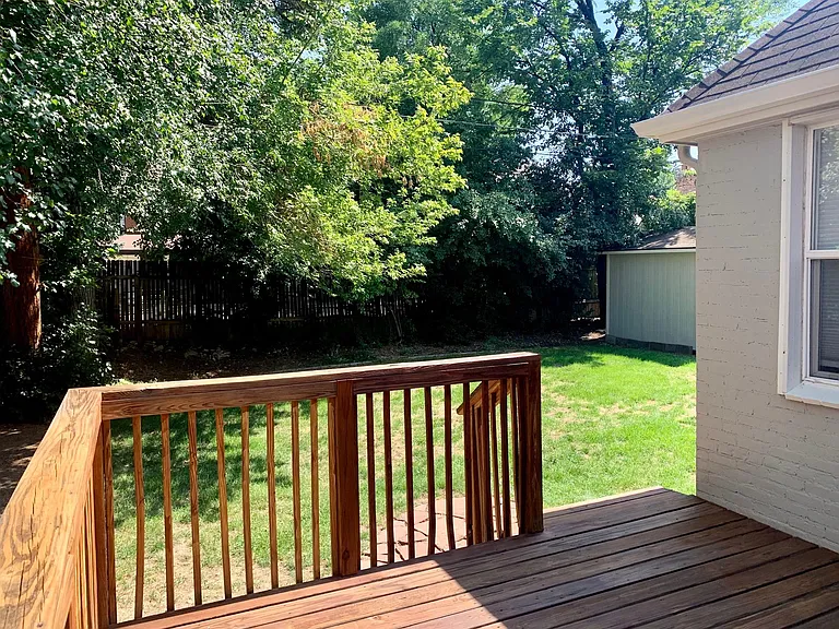 Deck off the kitchen into the backyard