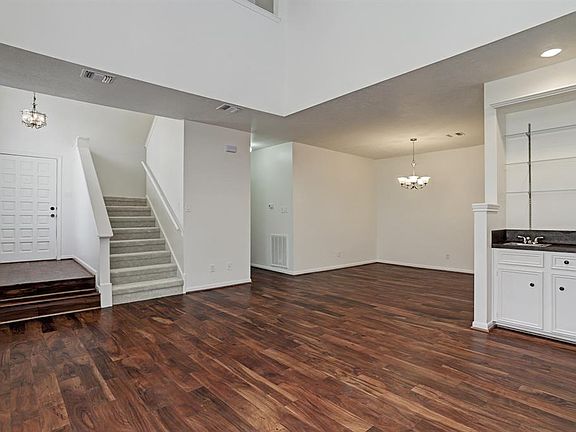 You have a view of the entry and the stairs that lead you to the secondary bedrooms. Plus you have your dining room and the wet bar area.