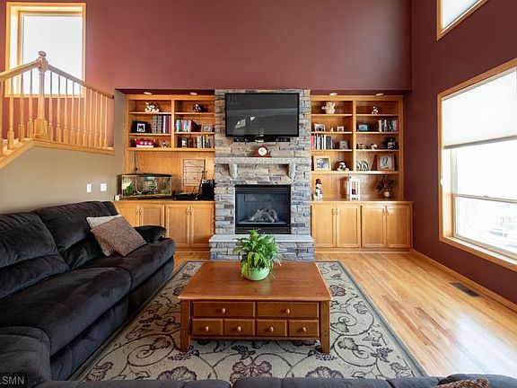 Stone fireplace and built in bookshelves