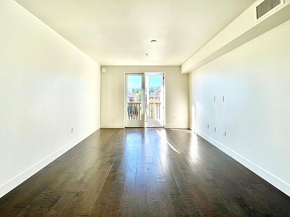Sun-filled Living room with hardwood flooring