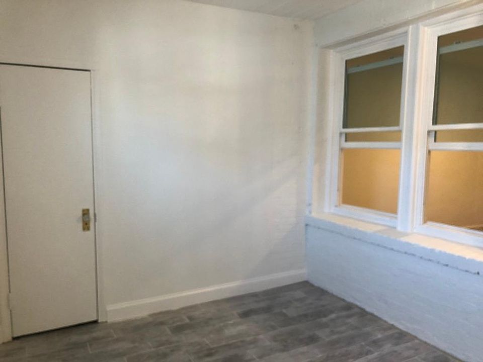 Spare room, windows lead to bedroom.