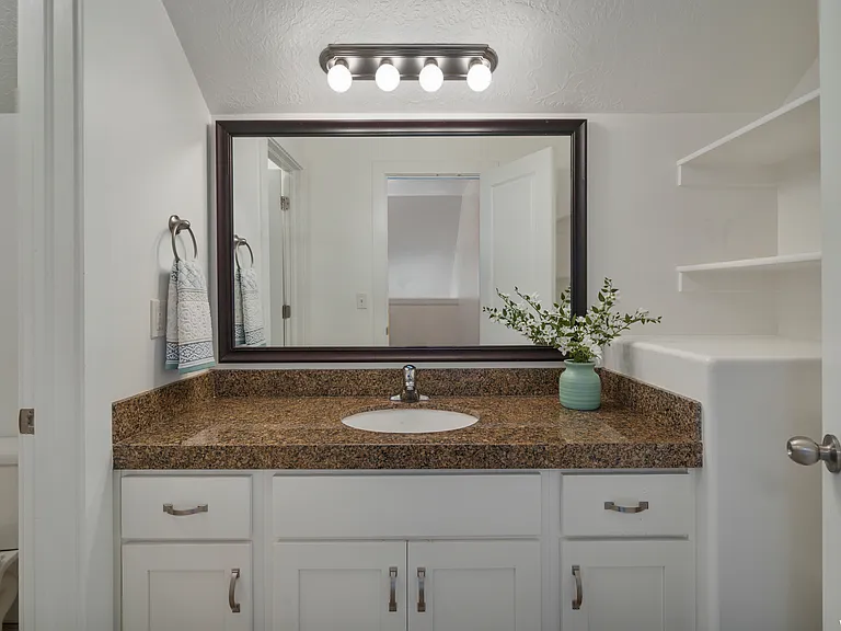 Upstairs bathroom with separate shower and toilet.
