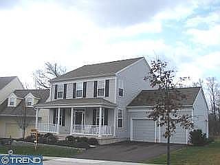 Colonial exterior w/extensive landscaping