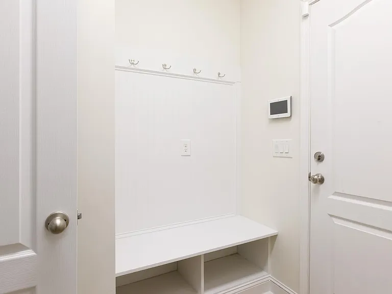Garage Foyer with bench and hooks